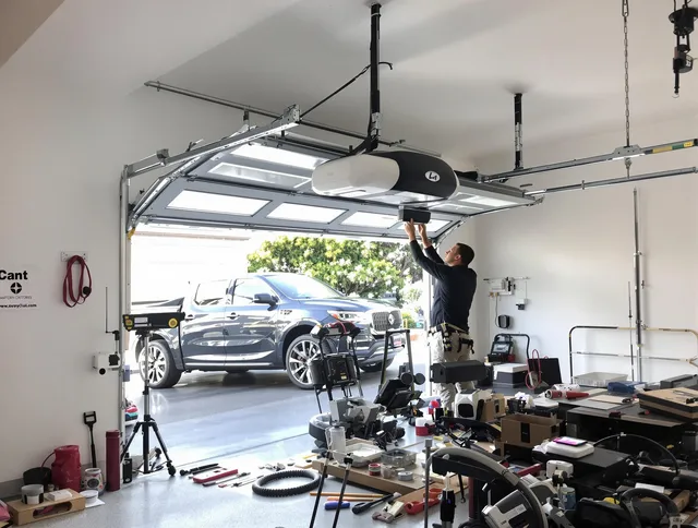Foxborough Garage Door Repair specialist installing smart garage door opener system in Foxborough home