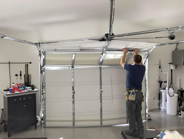Foxborough Garage Door Repair specialist performing precise section replacement on Foxborough garage door