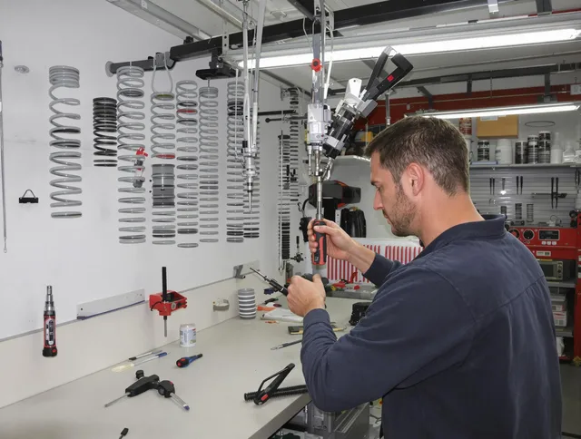 Foxborough Garage Door Repair safety certified technician performing precision spring replacement in Foxborough